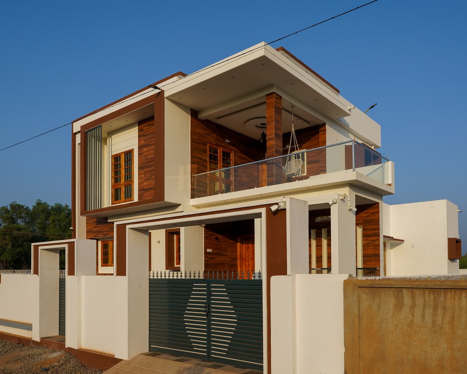 Completed modern low-rise residential family residence with balconies and compound wall in India